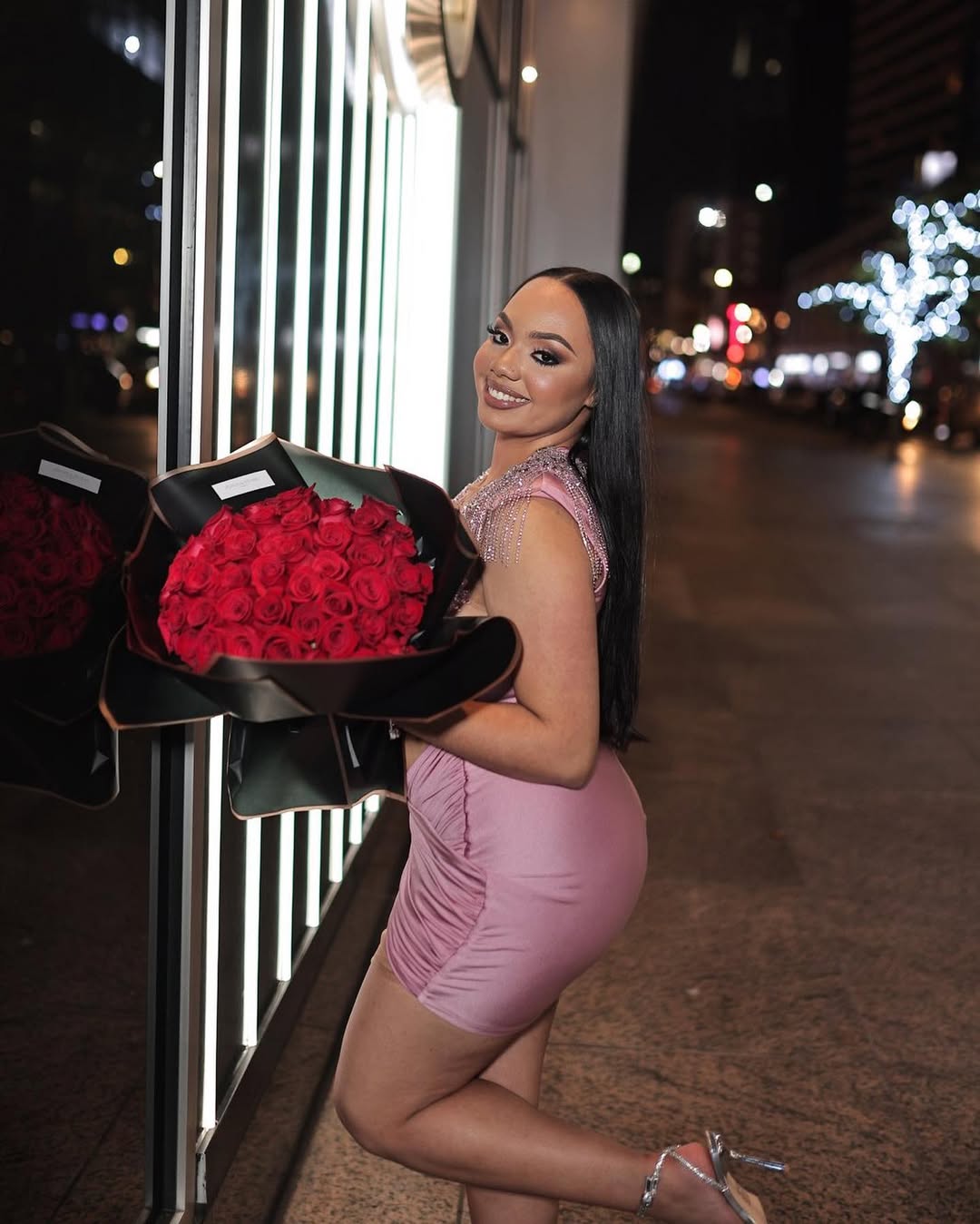 Elegant client with pink roses and luxury G-Wagon