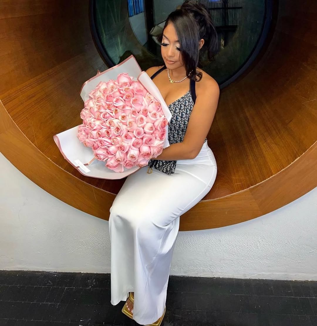 Elegant client with pink roses in modern interior