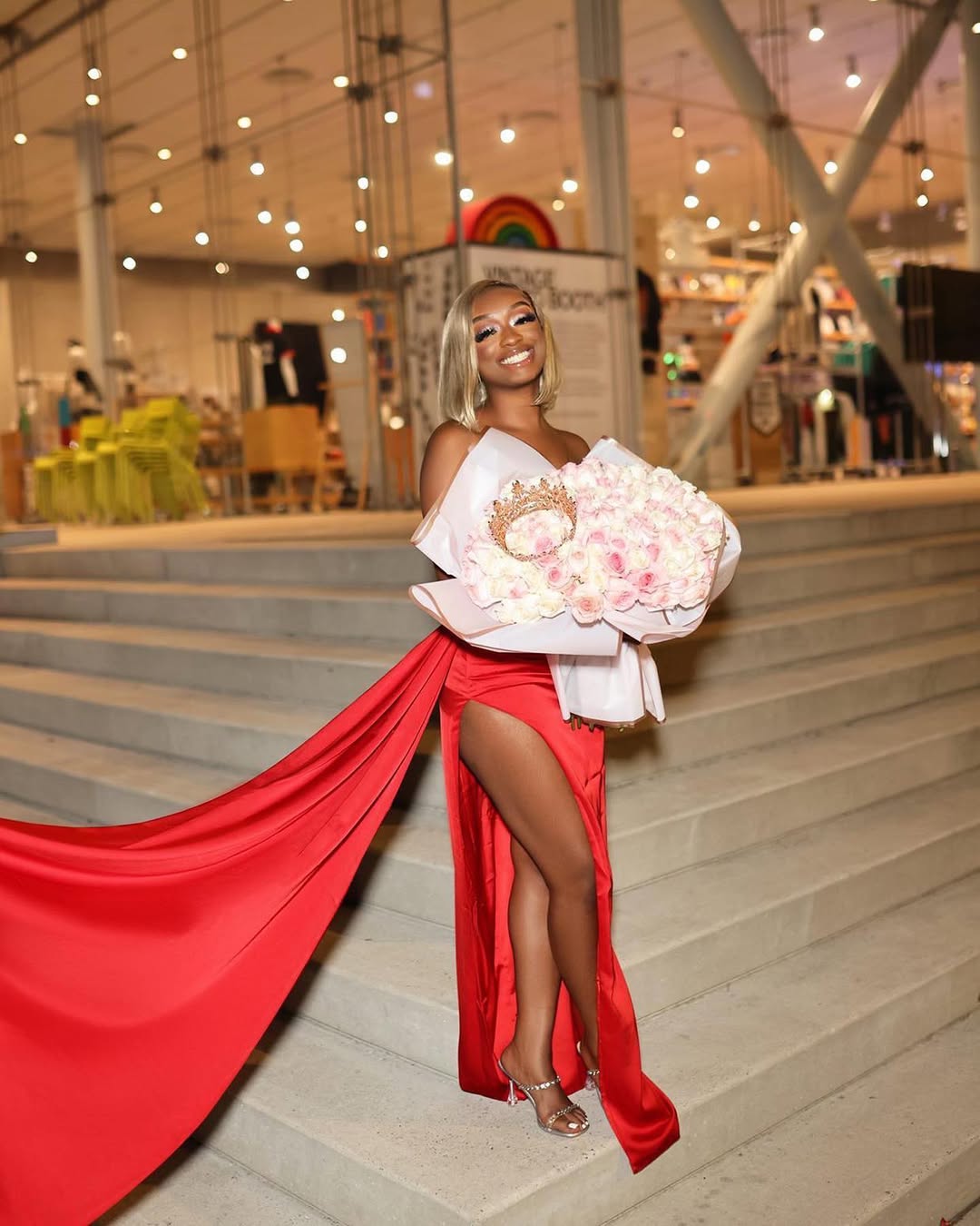Client with red roses in luxury car interior